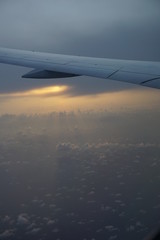 Fototapeta na wymiar Thai Airlines, Air plane wing, sky, sunset, plane wing, clouds, get plane