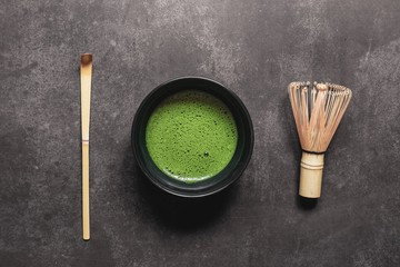 Fototapeta na wymiar Matcha green tea on wooden table background
