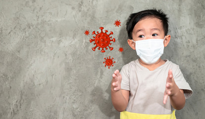 A boy wearing medical face mask for pollution or coronavirus,child itchy eyes and nose, Kid scratching nose while wearing protection mask.Protection against contagious disease, coronavirus.