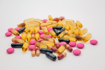 A pile of medicine pill and vitamin capsule. Concepts for medical illness and Supplements for health and antibiotic use of treatment.