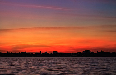 sunset over the city, sky, sun, red, water, sea, landscape, evening, beautiful, dusk, beautiful