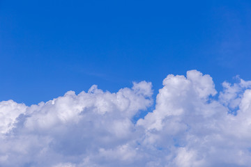 Naklejka na ściany i meble Blue sky background with white clouds on sunny day.