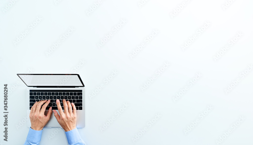 Aufkleber Top view of laptop with blank display. Businessman using laptop. White background.