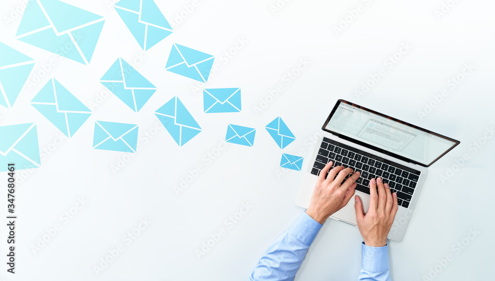 Poster business man sending and receiving email on white table. using laptop for writing mail.
