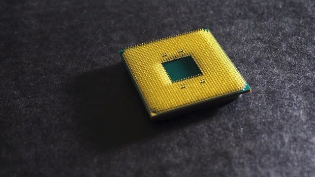 Green and yellow central processing unit (CPU), slow pan, wide close up