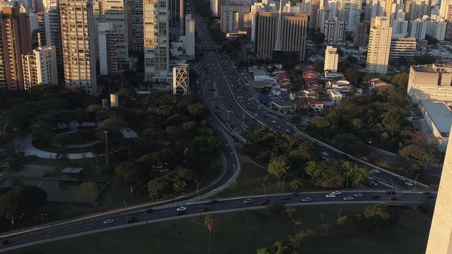 Aerial view of Vinte e Tres Maio Avenue at the sunset with buildings and a lot of cars, Sao Paulo, Brazil