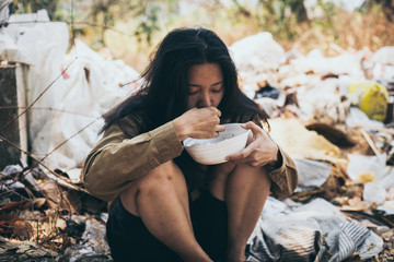 poor people,homeless or beggar begging for help sitting at dirty slum.concept for poverty...