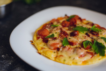 homemade pizza without oven. sausage, cheese, ham. meat, ripe, tomato. pizza making. small pizzeria
