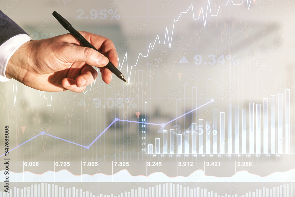 Poster multi exposure of trader hand with pen working with virtual abstract financial graph interface on bl