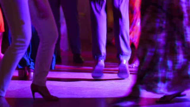 Men and women jumping and dancing