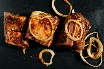 marinated meat cutted on pieces and ready for shashlik or kebab on black background
