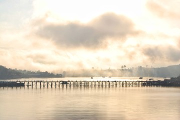Fototapeta premium Uttamanusorn Bridge or commonly known as Mon Bridge, the longest wooden bridge in Thailand and is the second longest in the world.