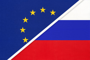 European Union or EU vs Russia national flag from textile. Symbol of the Council of Europe association.