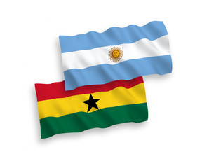 National vector fabric wave flags of Ghana and Argentina isolated on white background. 1 to 2 proportion.