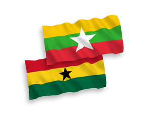 National vector fabric wave flags of Ghana and Myanmar isolated on white background. 1 to 2 proportion.