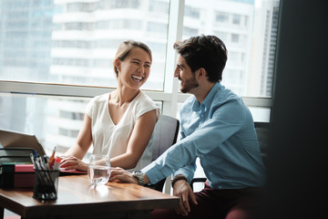 Obraz premium Two People Working Together With Laptop Computer In Corporate Office