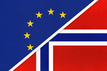European Union or EU vs Norway national flag from textile. Symbol of the Council of Europe association.