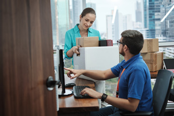 IT Expert Setting Computer To Woman Moving Into New Office