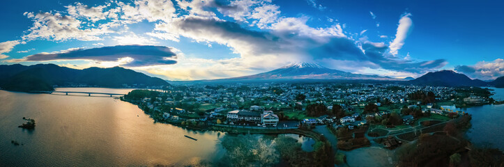 Japan. Panorama of Kawaguchiko from a height. The city at the foot of Fuji. The main mountain of Japan. Five lakes of Fuji. Bridge over lake Kawaguchiko. The top of mount Fuji among the clouds.
