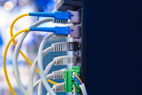 Colored Wires Are Connected To The Power Supply. Network Equipment. Optic Cable. Network. Server Room. Structured Cabling System. Fiber-optic Internet. Network Cables Are Connected To The Server.