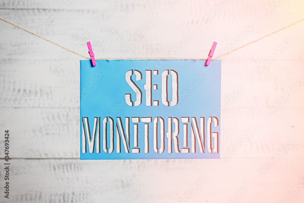 Poster handwriting text seo monitoring. conceptual photo tracking the progress of strategy made in the plat