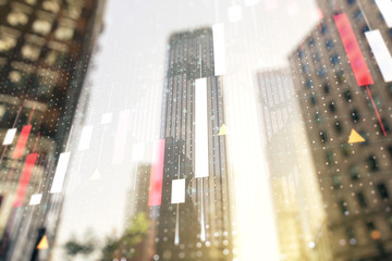 Double exposure of abstract financial graph with world map on office buildings background, financial and trading concept