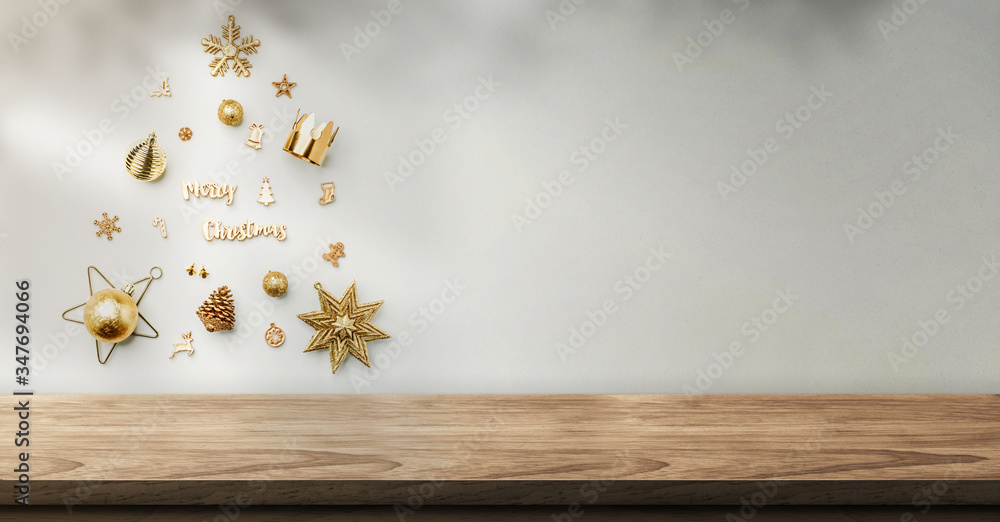 Poster christmas object decoration into xmas tree shape on wall with sunlight shadow on wall over wood tabl