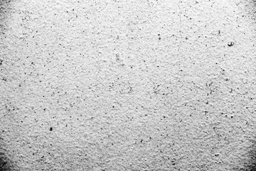 Texture of a concrete wall with cracks and scratches which can be used as a background