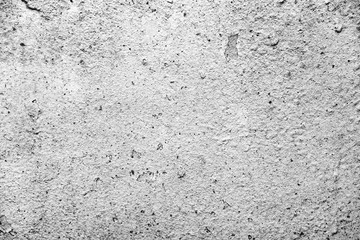 Texture of a concrete wall with cracks and scratches which can be used as a background