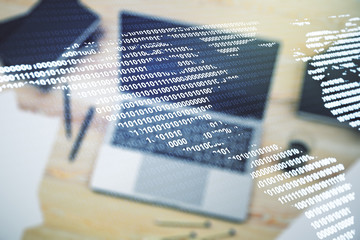 Digital America map on modern laptop background, international trading concept. Multiexposure