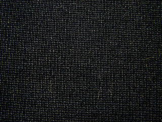 Dark structural background made of cotton fabric