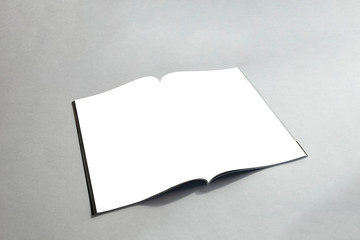 Blank open magazine on gray background. Realistic template of magazine book catalogue. Catalog mock up.
