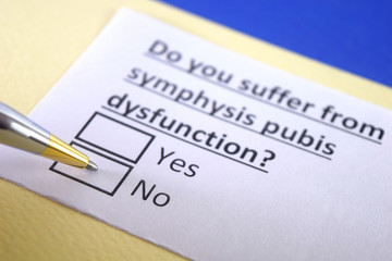 One person is decorated as a person answering question about symphysis pubis dysfunction.