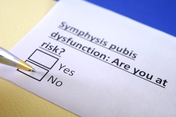 One person is decorated as a person answering question about symphysis pubis dysfunction.