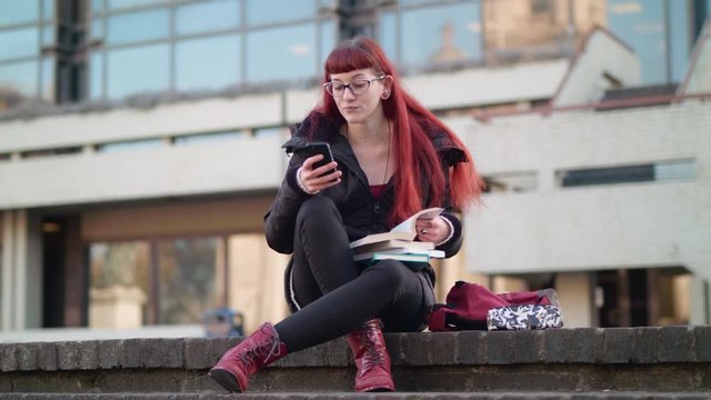 Slow motion shot of young women getting caught playing on her phone shen she should be working.
