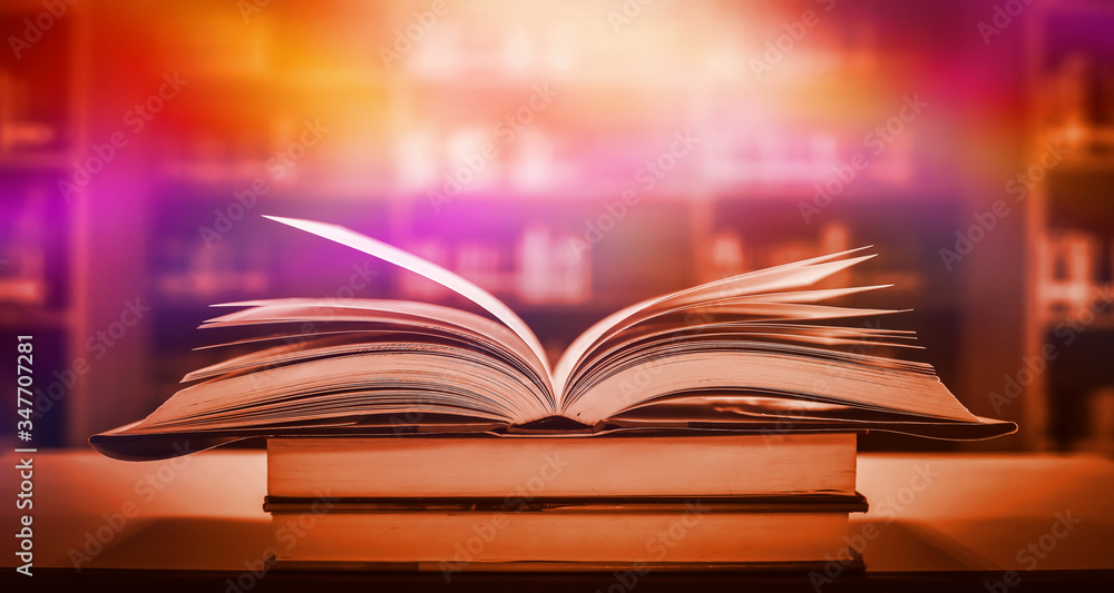 Poster stack of books in the library and blur bookshelf background