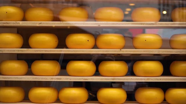 Huge cheese heads beautifully folded on store shelves in Holland.