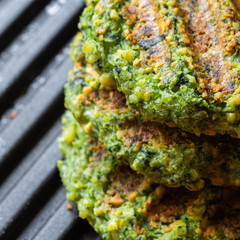 Vegan cutlets. Vegetarian, chickpea cutlets with spinach for a diet burger. .Vegan food. Grilled. Protein product.