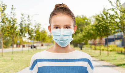 health protection, safety and pandemic concept - teenage girl in protective medical mask over city...