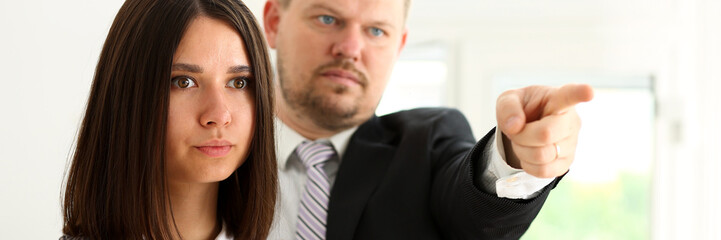 Angry yelling boss point arm to exit