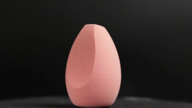 Sponge for makeup on a black background
