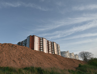 Fototapeta premium council apartment house tower flat block of apartments viewed from below. Ground and gravel in front of house