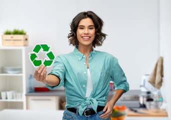 eco living, environment and sustainability concept - portrait of happy smiling young woman in...