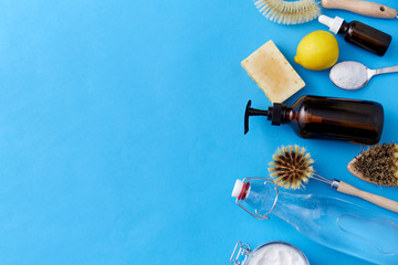 natural cleaning stuff, sustainability and eco living concept - lemon halves, washing soda, bottle...