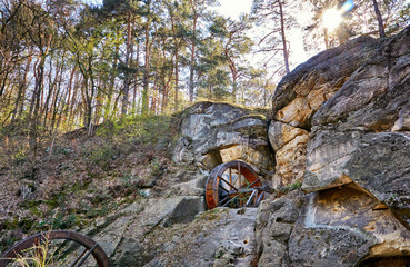 Mill wheels in the rock at the Regensteinmühle in Blankenburg in the sandstone rock landscape. Harz National Park. Saxony-Anhalt, Germany