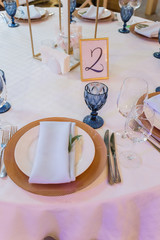 plates and with a decor on the wedding table