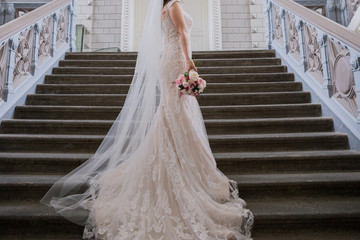 bride in a vintage building on the stairs