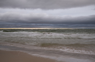 Cloudy sunset at the beach of a national park in sweden