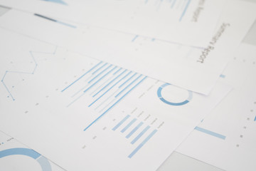 Business document report data with bar charts, pie charts, line graphs, on paper. Research data for market analysis and corporate financial planning.