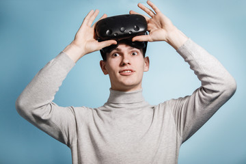 Guy plays with virtual reality glasses